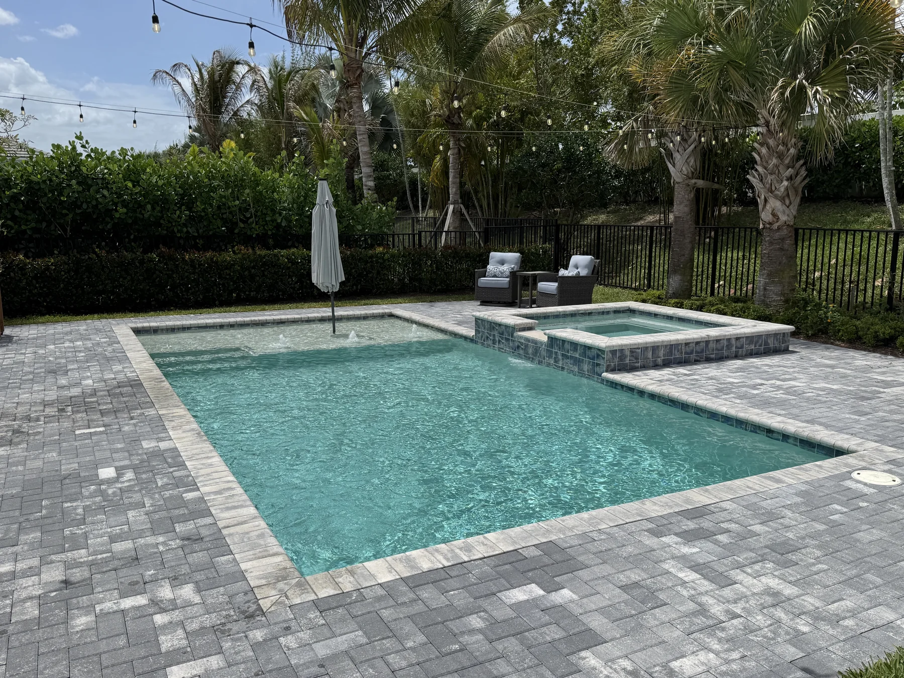 Pebble finish popping, grout bright, water magazine-ready