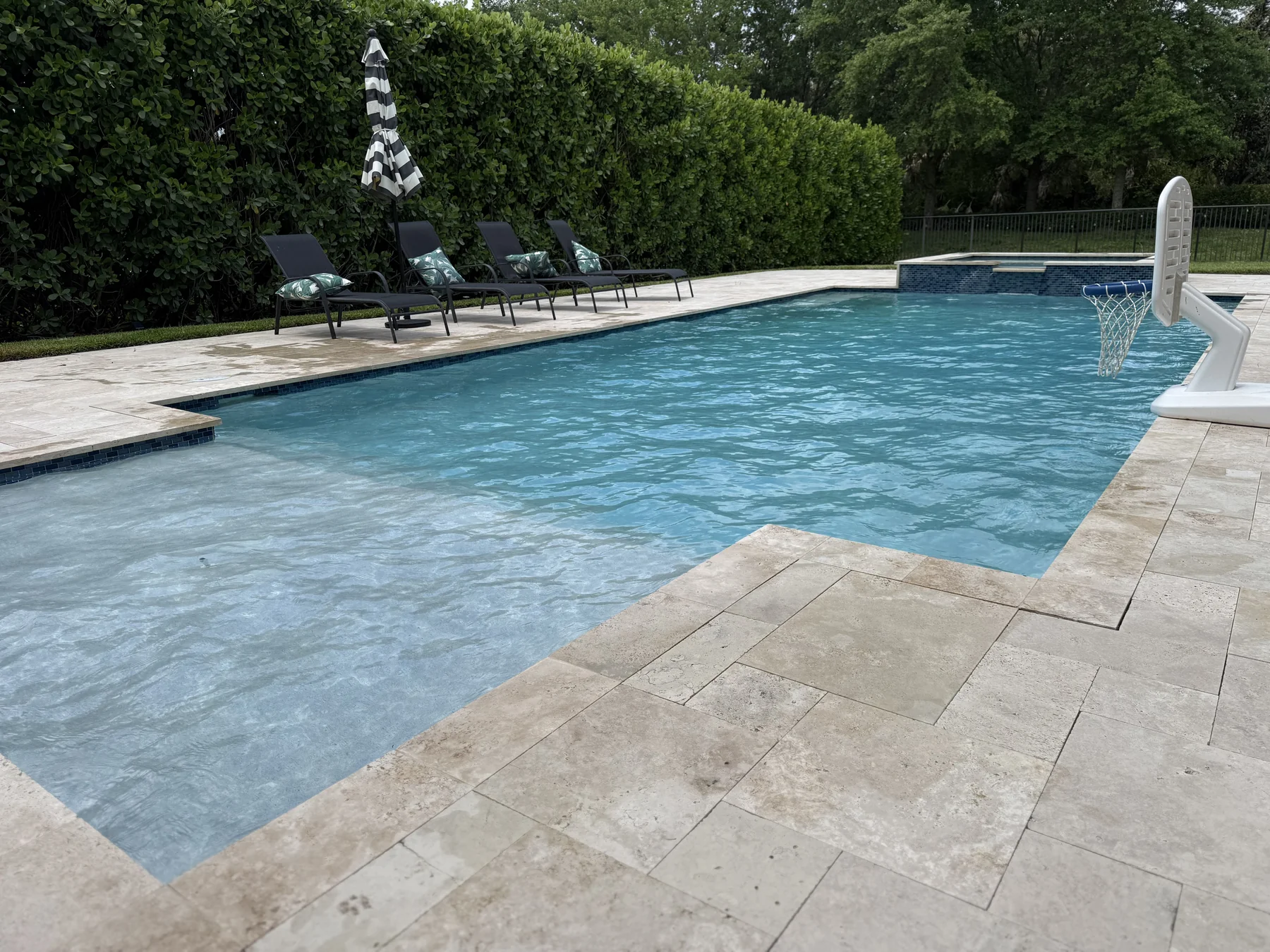 Paver deck, lap lane, glass-top water — Jupiter at its finest