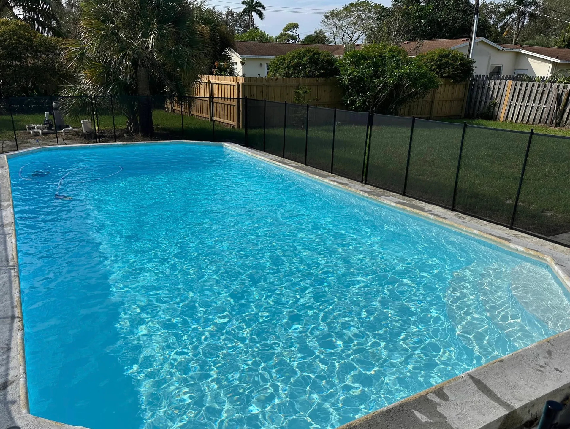 Backyard pool looking like it just filled yesterday — it didn't, we just showed up Tuesday